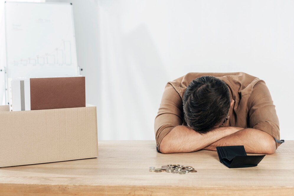 Medium shot depressed man table 23 2148773950