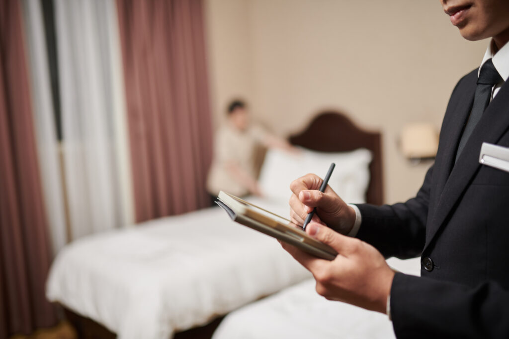 Hotel manager checking document on tablet
