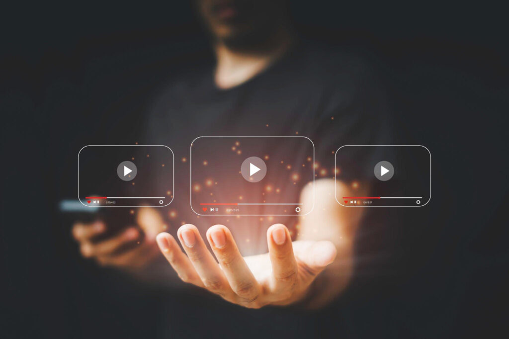 Man holds screen with video strip it